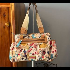 On the shoulder bag.